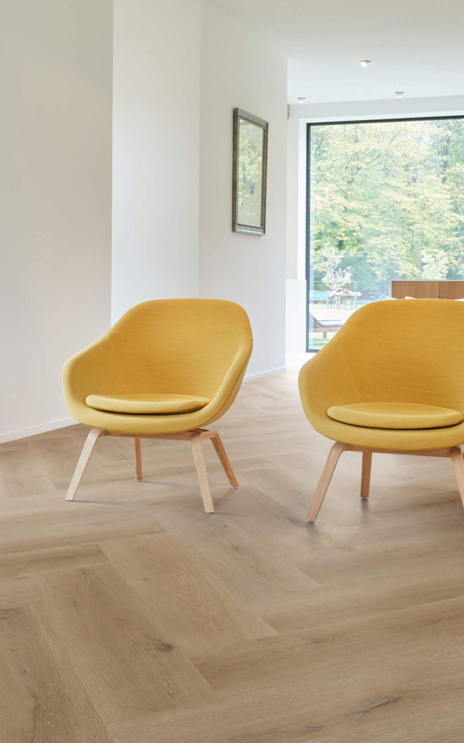 Vinyl flooring with yellow chair | Hubbard Flooring Studio