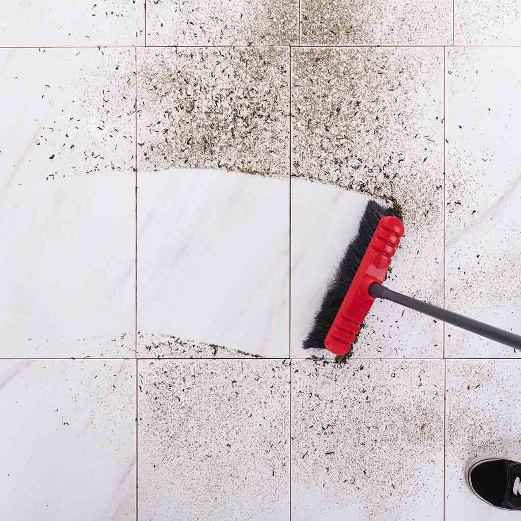 Broom cleaning Dirt On tiled floor | Hubbard Flooring Studio